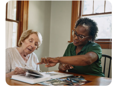 Caregiver supporting an older adult at home
